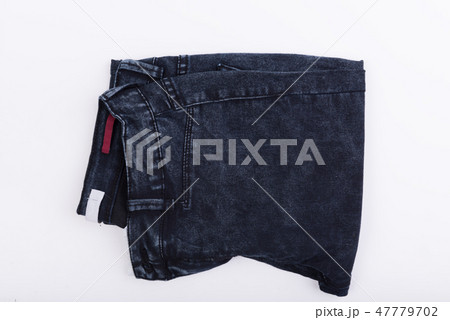 Dark blue jean fabric isolated on white background 47779702
