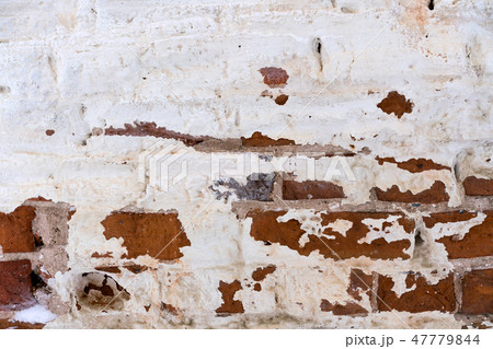 old flaked unrestored brick wall of an orthodox 47779844