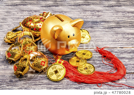 Piggy bank with golden coins and chinese ornament 47780028