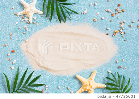 Light blue background with white sand 47785601
