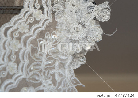 close up on ripped wedding dress 47787424