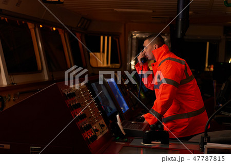 Navigation officer. Pilot on a bridge of a vessel. 47787815