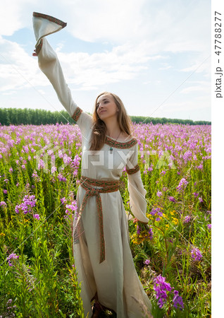 Beautiful girl relaxing with flowers 47788277
