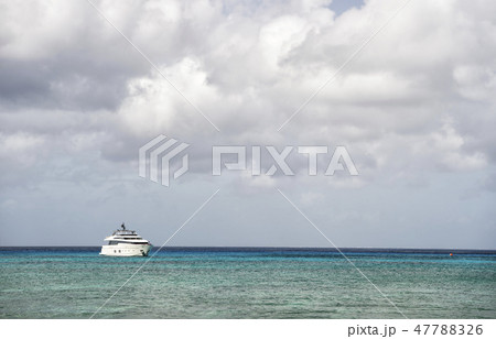 Yacht on water with cloudy sky 47788326