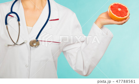 Dietitian nutritionist with grapefruit. Dietitian nutritionist with grapefruit. 47788561