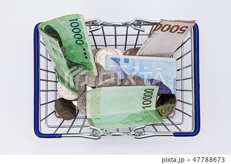 Shopping basket with coins and korean won bills  47788673