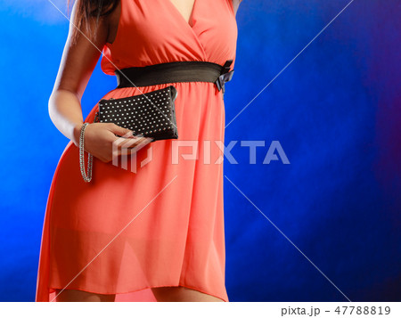Evening handbag in woman hand Evening handbag in woman hand 47788819