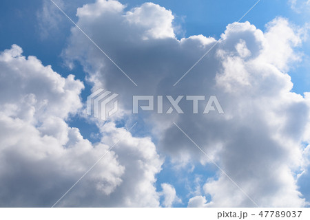 Blue sky and big white cloud background 47789037