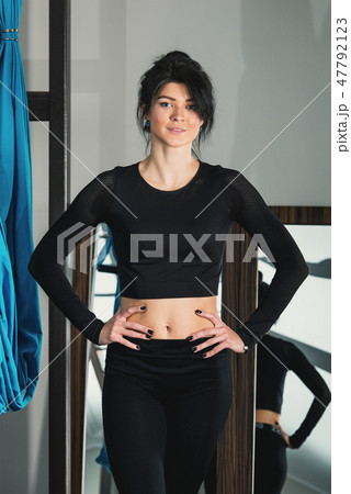 beautiful woman in a black workout suit. Yoga instructor beautiful woman in a black workout suit. Yoga instructor 47792123