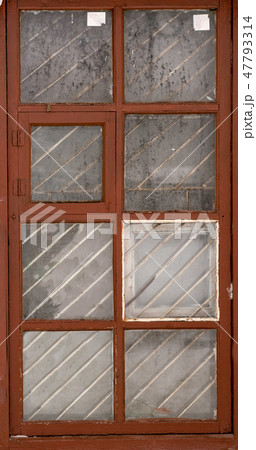 an isolated old-fashioned window of an old house  47793314