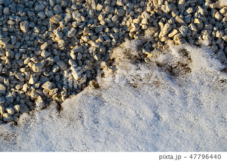 Snow with rubble as an abstract background 47796440