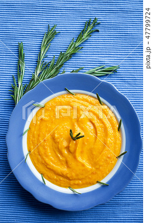 pumpkin soup in a plate 47799724