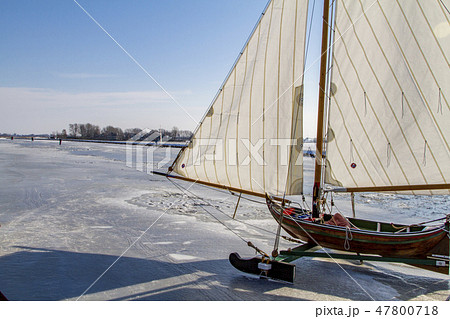 Dutch ice sailboat on a frozen river at the Kaag Dutch ice sailboat on a frozen river at the Kaag 47800718