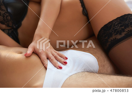 Woman touching man close up. 47800853