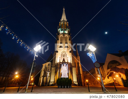 Mariacki church with angel in Katowice 47802080