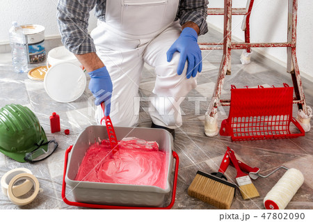Professional house painter prepares the wall paint Professional house painter prepares the wall paint 47802090