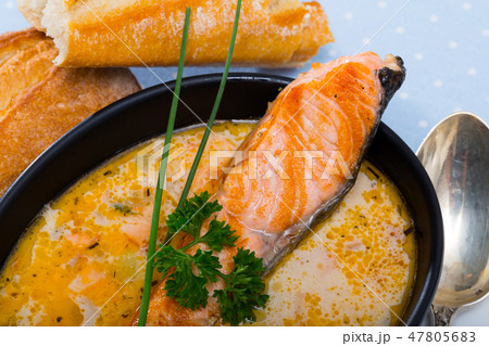 Salmon cream soup with bread 47805683