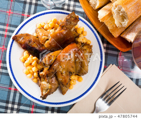 Top view of fried pig legs with chickpeas 47805744