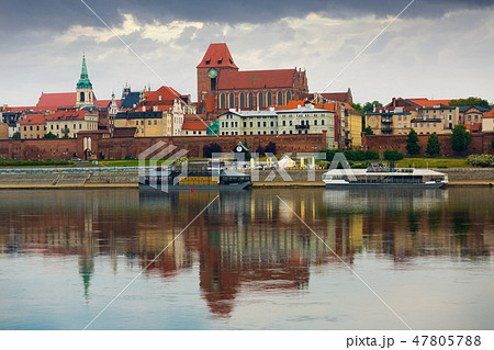 Torun across Vistula with Catholic church 47805788