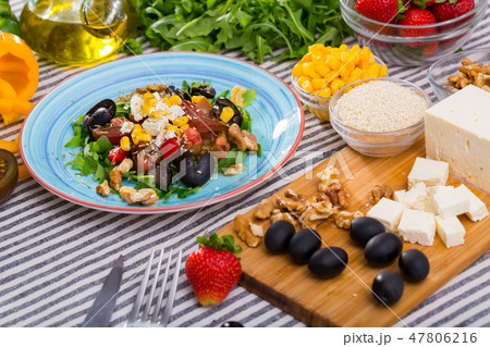 Ingredients for salad from arugula and vegetables Ingredients for salad from arugula and vegetables 47806216