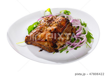 Roasted pork rack of ribs with greens Roasted pork rack of ribs with greens 47806422