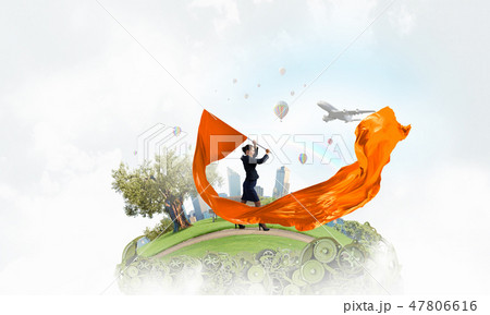 Woman waving yellow flag 47806616