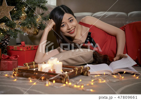 Woman reading on winter night 47809661