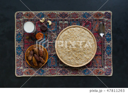 Oatmeal with dates and milk. Ramadan food.  47811263