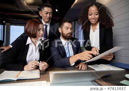 Multi-ethnic business team reading contract Multi-ethnic business team reading contract 47815037