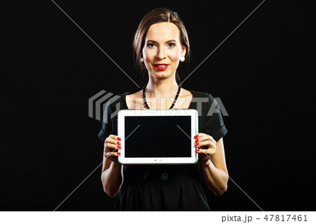 woman retro style showing tablet woman retro style showing tablet 47817461