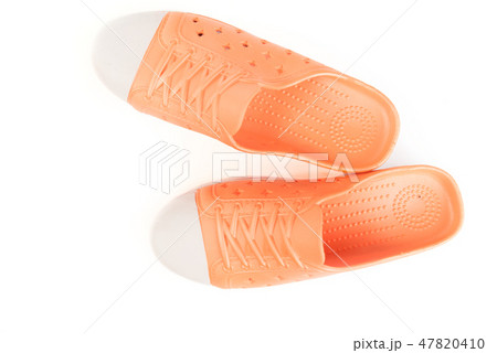 Top view orange shoes isolated on white background 47820410