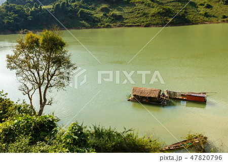 Vietnamese houseboat on the water Vietnamese houseboat on the water 47820796