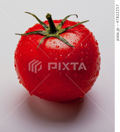 Wet tomato on isolated on white 47822257