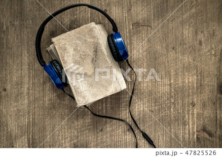 Old book and headphones Old book and headphones 47825526