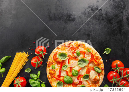 Tasty vegetarian pizza on dark background Tasty vegetarian pizza on dark background 47825694
