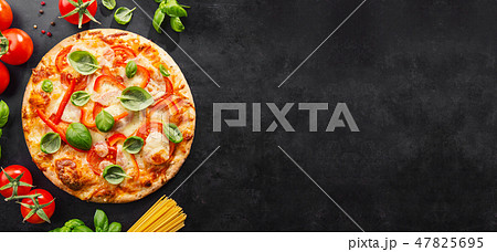 Tasty vegetarian pizza on dark background 47825695