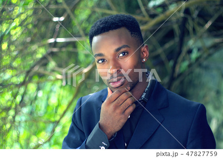 man portrait outside summer confident smiling 47827759