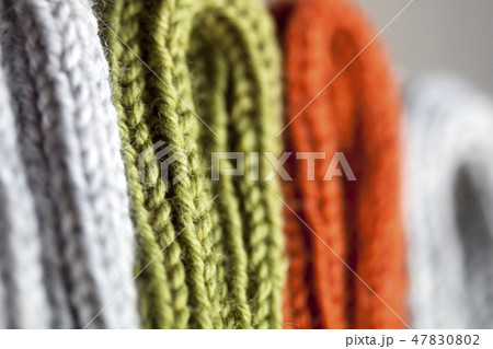 Orange, green and grey wool knitted texture 47830802