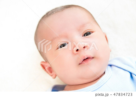Innocent newborn baby face in white background 47834723