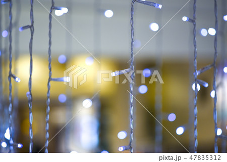 White blue electric colored garland, background White blue electric colored garland, background 47835312