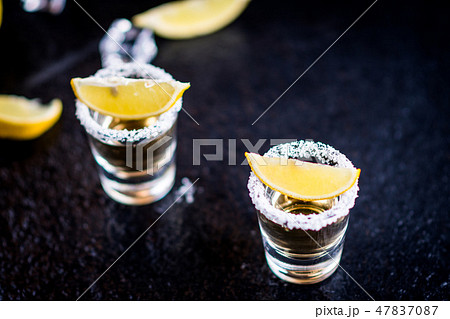 Tequila with lemon and lime Tequila with lemon and lime 47837087