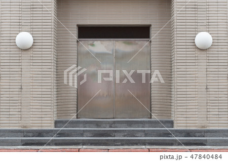 sidewalk by street wall & door sidewalk by street wall & door 47840484