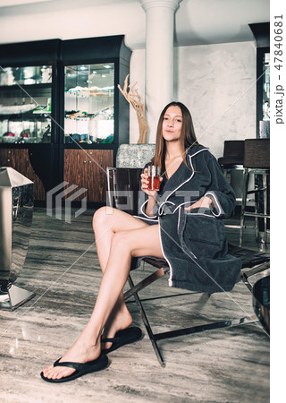 Beautiful woman relaxing in bathrobe in spa center 47840681