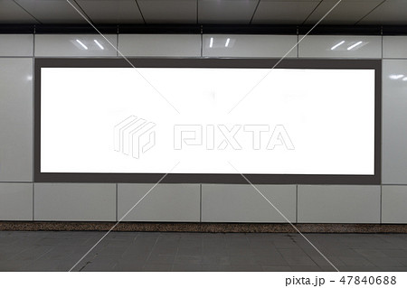 Large blank billboard on a street wall 47840688
