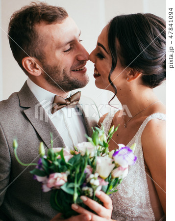 Bride and groom embrace 47841094