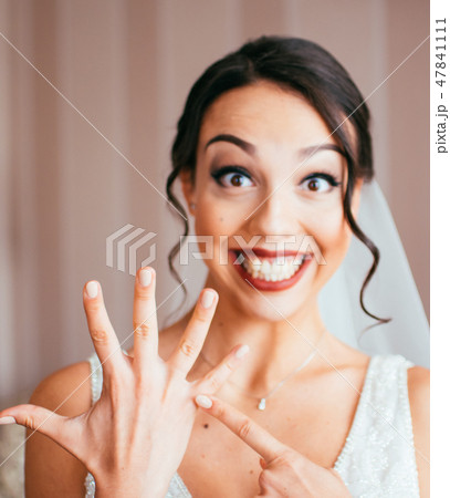 Portrait of pretty laughing bride 47841111