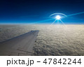 UFO flies near airplane in dark blue sky 47842244