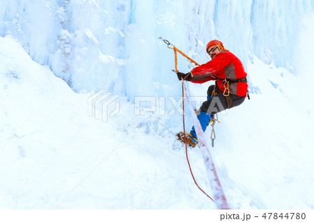 climber moves traverse the ice wall 47844780