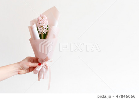 Woman hand with manicure holding spring flowers. Fresh bouquet with hyacinth. Copyspace for text Woman hand with manicure holding spring flowers. Fresh bouquet with hyacinth. Copyspace for text 47846066