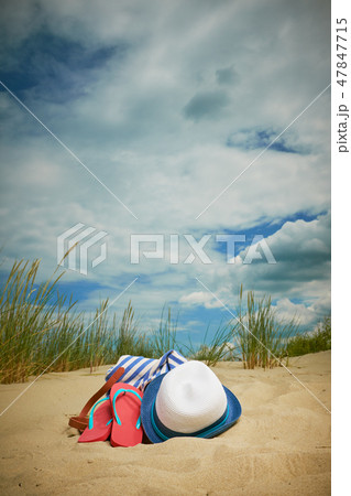 hat and flip flops on summer sand beach hat and flip flops on summer sand beach 47847715